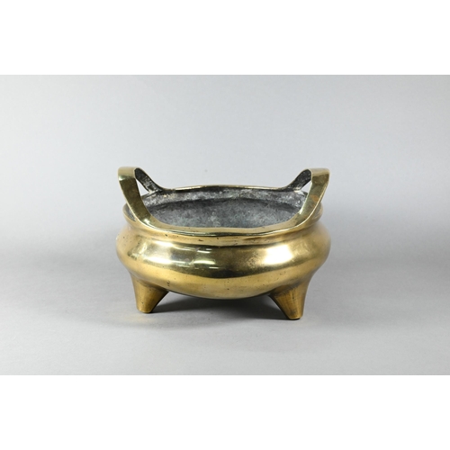 450 - A large 19th century Chinese bronze tripod censer, compressed globular form with loop handles standi... 