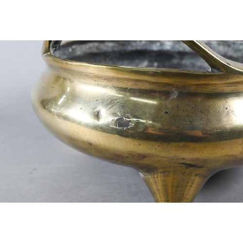 450 - A large 19th century Chinese bronze tripod censer, compressed globular form with loop handles standi... 