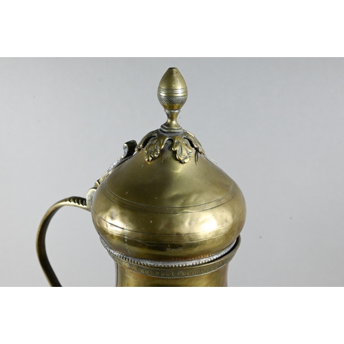 470 - An antique Persian brass water carrier with hinged cover and loop handle, decorative horizontal band... 