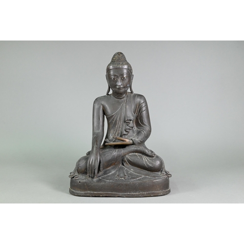 472 - A large 19th century Burmese Mandalay style bronze Shakyamuni Buddha, seated in the lotus position o... 