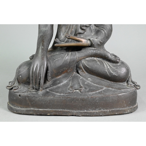 472 - A large 19th century Burmese Mandalay style bronze Shakyamuni Buddha, seated in the lotus position o... 