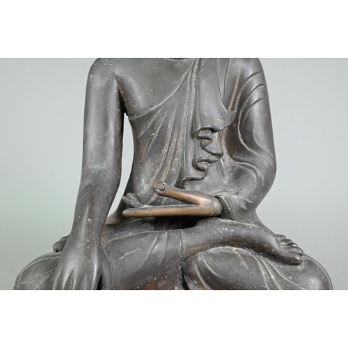 472 - A large 19th century Burmese Mandalay style bronze Shakyamuni Buddha, seated in the lotus position o... 