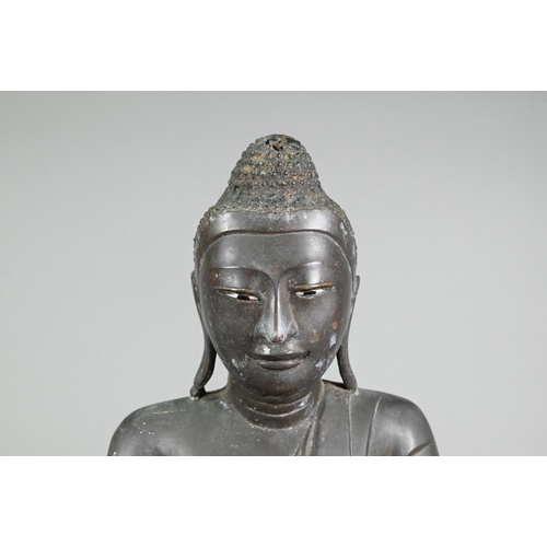 472 - A large 19th century Burmese Mandalay style bronze Shakyamuni Buddha, seated in the lotus position o... 