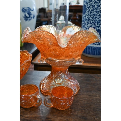 91 - #Two Carnival glass punch-bowls on pedestals - one with eight matching glasses, to/w a similar fruit... 