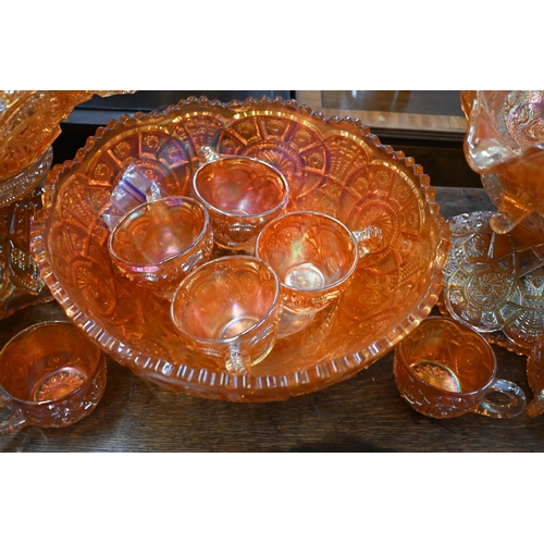 91 - #Two Carnival glass punch-bowls on pedestals - one with eight matching glasses, to/w a similar fruit... 