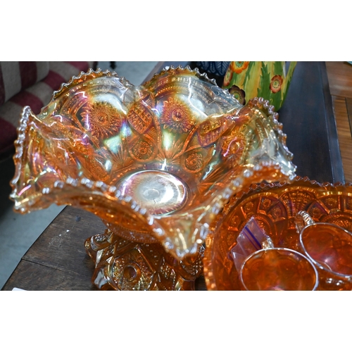 91 - #Two Carnival glass punch-bowls on pedestals - one with eight matching glasses, to/w a similar fruit... 