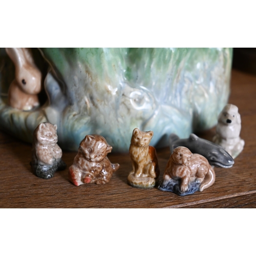 104 - A Sylvac 'stump' vase mounted with snub-nosed bunnies to/w various Wade Whimsies and other miniature... 