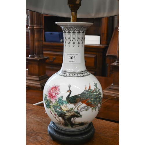 105 - A pair of Chinese ceramic baluster table lamps decorated with peacocks in the famille rose manner, 2... 