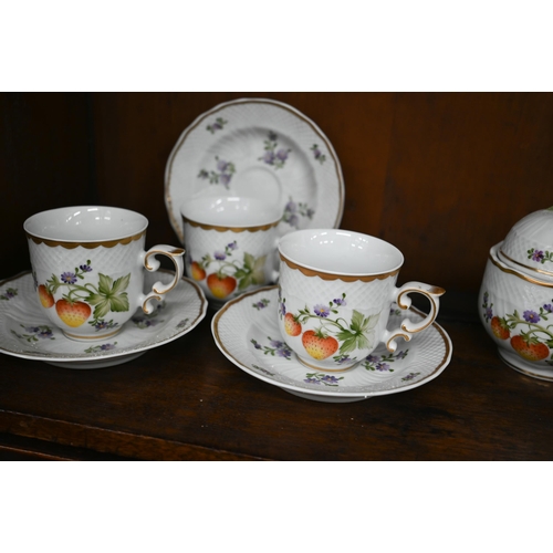 112 - A Hollohaza (Hungary) china coffee service, painted with fruit and flowers to/w a pair of Herend nap... 