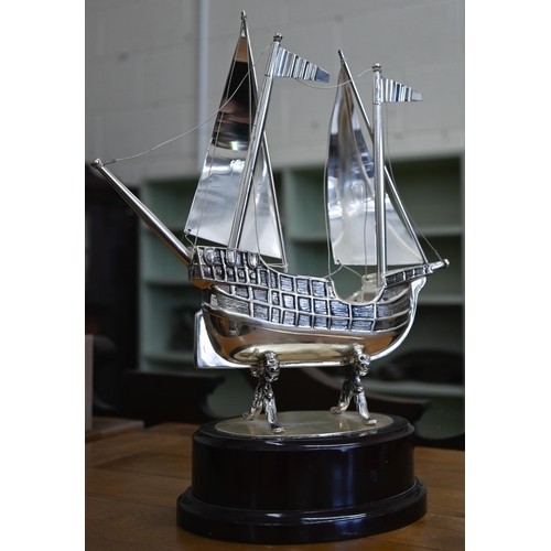 123 - A Spanish ep model galleon, 33 cm high to/w a Victorian copper kettle and a patent copper 'Hydropath... 