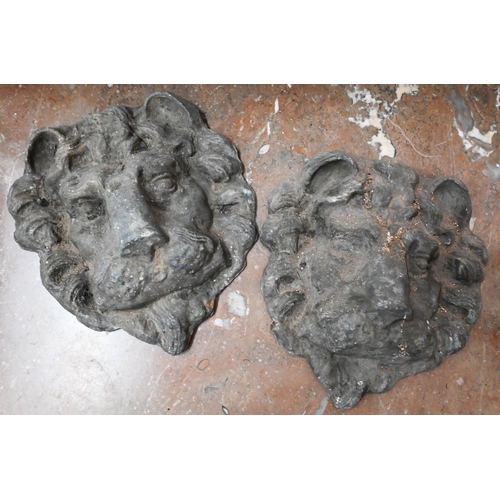 130 - A pair of cast lead lion-masks, 22 cm high