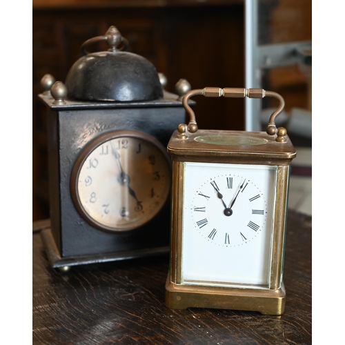 132 - A French brass carriage clock, 15 cm high overall, to/w an American painted tin alarm clock (2)