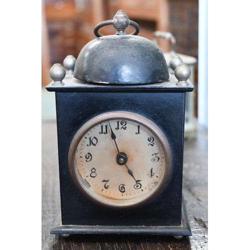 132 - A French brass carriage clock, 15 cm high overall, to/w an American painted tin alarm clock (2)