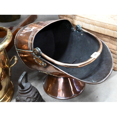 174 - Two Victorian coal helmets in copper and brass to/w a preserving pan and dinner gong (4)