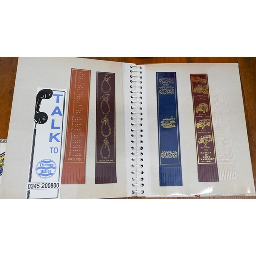 178 - A collection of leather and other bookmarks in three albums, in a pink flight-bag