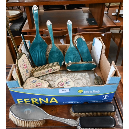 180 - A silver hairbrush, to/w a gilt metal and enamelled brush set and another brush set on tray etc (box... 