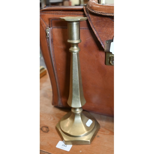 205 - #A pair of brass candlesticks, stamped with registered number, 30 cm high to/w a leather Norris brie... 