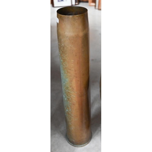 211 - Two large brass artillery shell-cases (suitable for stick-stands), to/w a stemmed copper jardiniere ... 