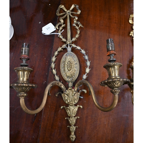 215 - A pair of Adam-style gilt metal twin-branch wall-lights, 45 cm high