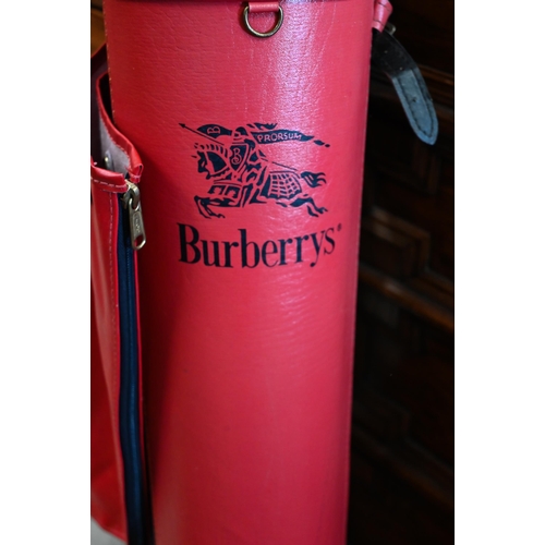 218 - A Burberrys red leather golf bag with cover