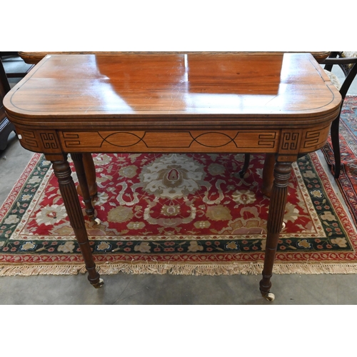 219 - A 19th century mahogany and ebony strung card table with folding baize lined top on turned and reede... 