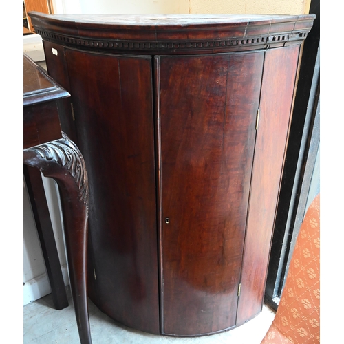 226 - #A 19th century mahogany barrel front hanging corner cupboard