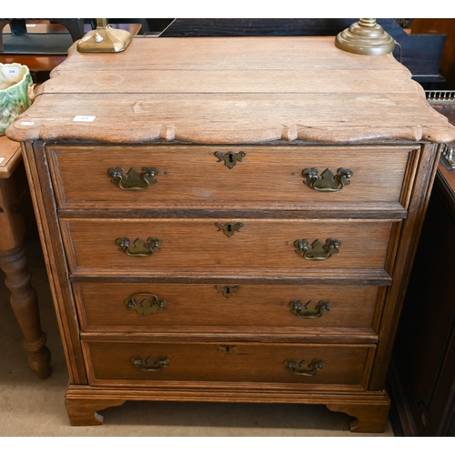 An antique Continental oak chest with serpentine top over four long drawers with brass handles on bracket feet, 82 cm wide x 52 cm deep x 90 cm high