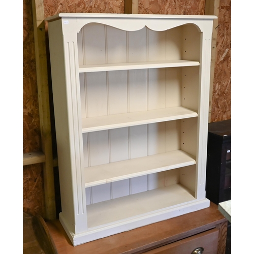 544 - A cream painted open bookcase with three adjustable shelves, 92 cm wide x 28 cm deep x 118 cm high