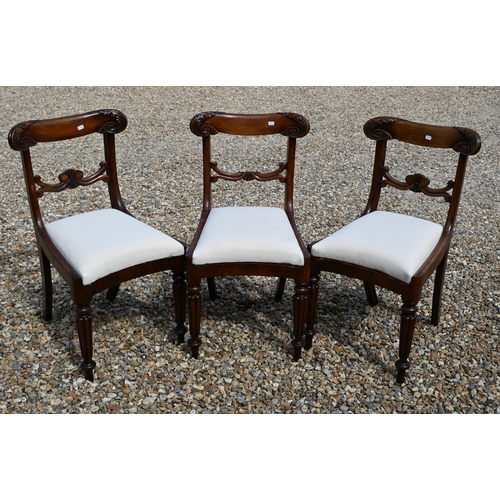 546 - Three Regency mahogany bar back side chairs with calico pad seats on turned and reeded front legs (3... 