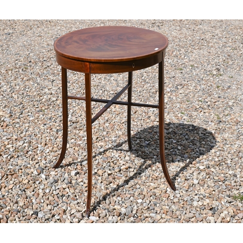 547 - An Edwardian walnut oval occasional table with hinged top and slender splayed supports, 52 cm wide x... 