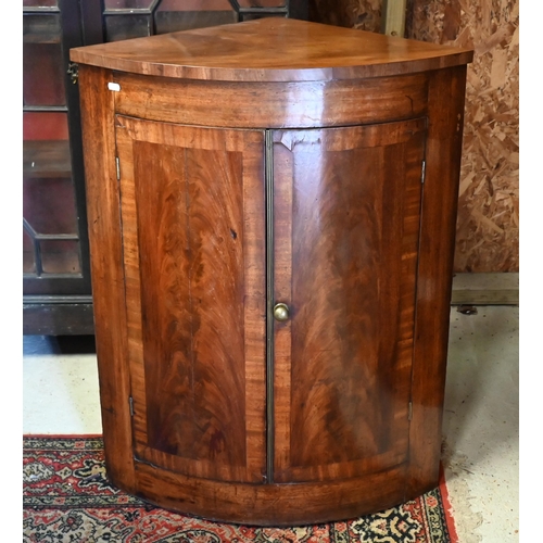 548 - George III walnut hanging corner cupboard