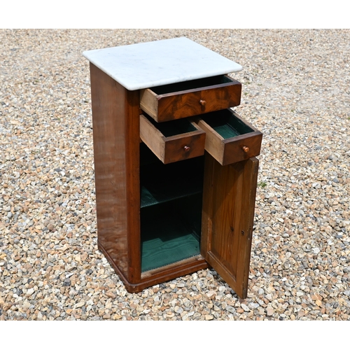 553 - A 19th century marble top bedside cabinet with three drawers over panelled cupboard door, 40 cm wide... 