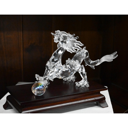 79 - D - Swarovski crystal glass 'Wild Horses' and dragon figures, both boxed to/w unboxed Swarovski 'Lin... 