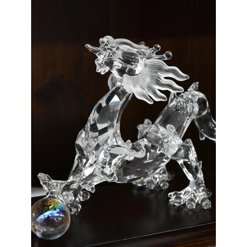 79 - D - Swarovski crystal glass 'Wild Horses' and dragon figures, both boxed to/w unboxed Swarovski 'Lin... 