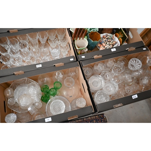 93 - A large quantity of cut and other drinking glasses and tableware to/w two large green serving dishes... 