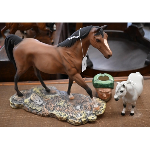 99 - A Royal Doulton figure of a racehorse 29 x 33 cm to/w a Shetland Pony and an 'Auld Mac' character as... 