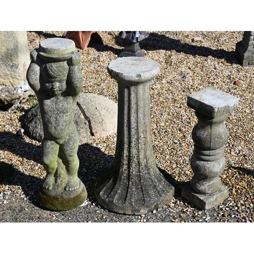 7 - A weathered reconstituted stone cherub pedestal, 66 cm high to/w two other garden pedestal/stands (3... 