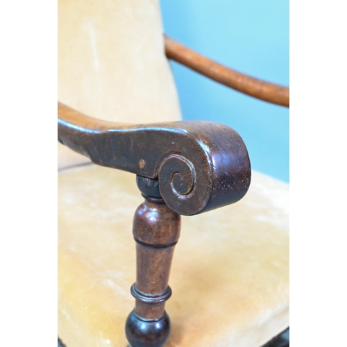 858 - An 18th century walnut open framed and upholstered high back armchair, on a part turned H stretcher ... 