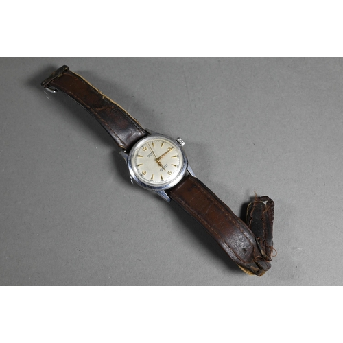 415 - A vintage gents Olma wristwatch, the champagne dial with gilt markers and hands within a 32 mm steel... 