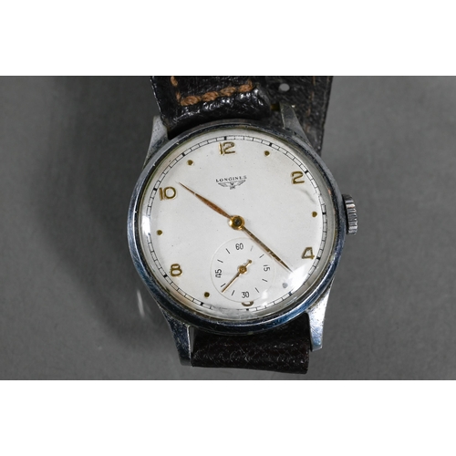 418 - A Vintage Longines gents wristwatch, the champagne dial with subsidiary seconds within a 32 mm dia. ... 