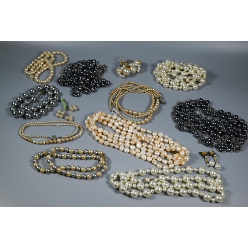 309 - Collection of various simulated and cultured pearl necklaces, various colours, lengths, sizes etc (b... 