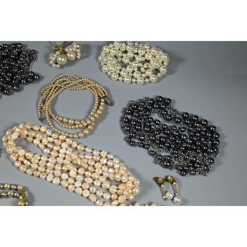 309 - Collection of various simulated and cultured pearl necklaces, various colours, lengths, sizes etc (b... 