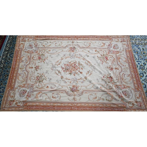 802 - A traditional Savonnerie needlepoint rug, pale camel ground, 266 cm x 173 cm