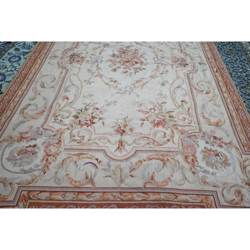 802 - A traditional Savonnerie needlepoint rug, pale camel ground, 266 cm x 173 cm