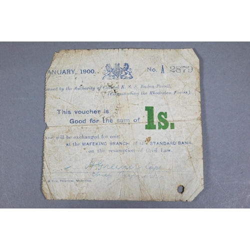 1064 - A Mafeking one shilling note no. 2879 issued January 1900, in worn condition