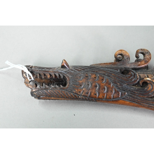 1135 - Indonesian sectional stained and carved bone 'dragon' blow-pipe, 140cm, to/w a companion quiver for ... 