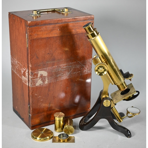 1119 - A lacquered brass microscope by Henry Crouch, London, no 1494, in fitted case with optics and other ... 