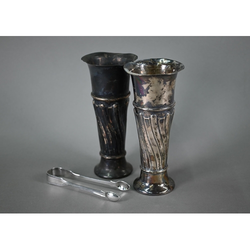 101 - An Edwardian pair of loaded silver vase-flutes, Walker & Hall Sheffield 1901, 21cm high, to/w a ... 