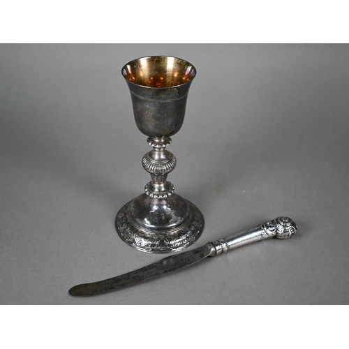 108 - An antique white metal chalice with gilded bowl and baluster stem (stamps underneath not recognised)... 