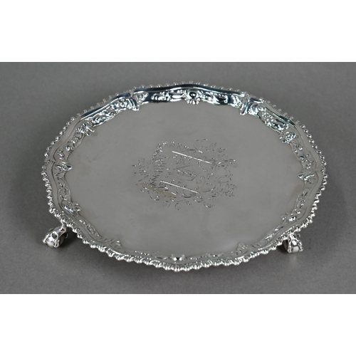 111 - An early George III silver card salver with gadrooned and floral-embossed rim, on claw and ball feet... 